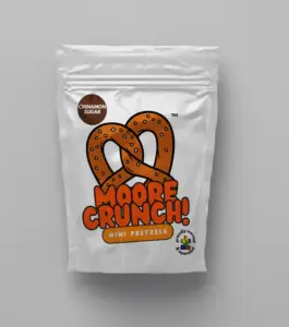 shiny white bag with cute picture of brown pretzel with orange words saying Moore Crunch Mini Pretzels Cinnamon Sugar