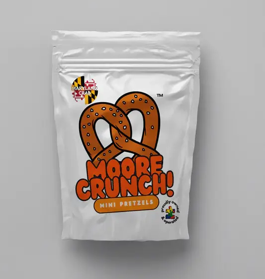 shiny white bag with cute picture of brown pretzel with orange words saying Moore Crunch Mini Pretzels Maryland Crab